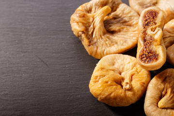 Dried figs on a dark rustic background