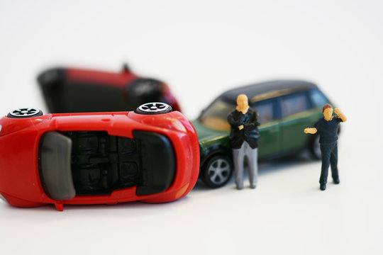 Car Accident And Miniature People Waiting The Police