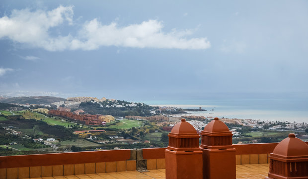 Cloudy view to Manilva from hill in Spain