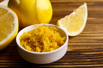 Lemon and juice on a wooden background