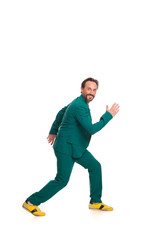 Smiling handsome man in green suit. Isolated on white background.