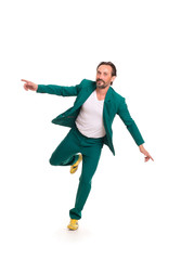 Fototapeta premium Careless man in nice green suit. Immitating flying.