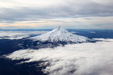 Snow-capped mountain peak from the air.