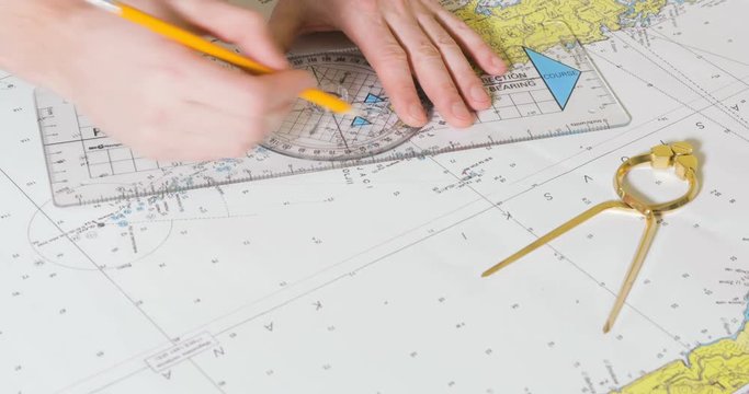 Person making course for trip by the sea.