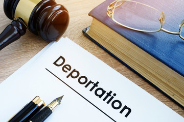 Deportation and other documents on a desk. - obrazy, fototapety, plakaty