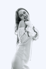 Young woman with white dress posing on white background
