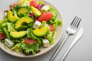 Fresh healthy salad with avocado, grapefruit