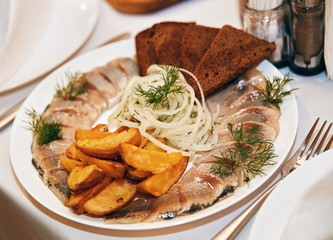 herring with bread and potatoes