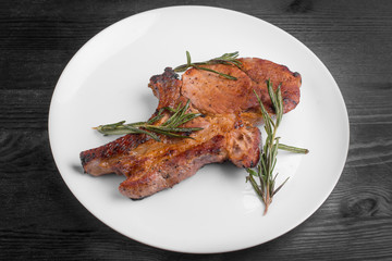 steak pork on a plate with rosemary