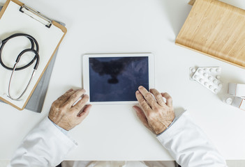 Doctor Using Tablet