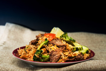 Homemade Chinese fried rice with vegetables and fried eggs
