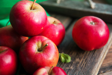 group of red apples on wooden natural background, fresh natural food and vitamins concept in rustic style
