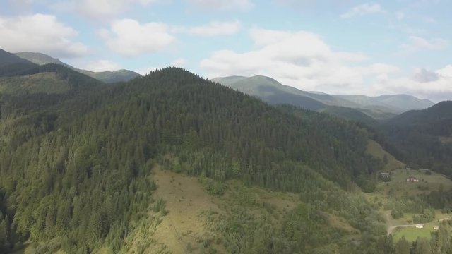 Flying other summer carpathian mountains near by Dzembronya village at sunny day, Ukraine