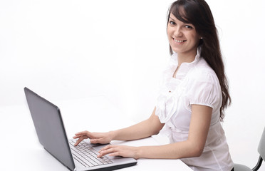 young woman typing text on laptop keyboard