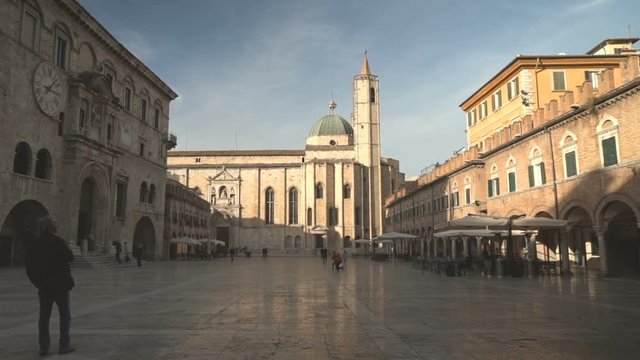 Wide and beautiful town square in Ascoli, in the Marche, church in background.
