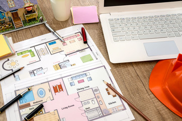 Obraz premium architectural plan of the house, laptop, helmet, layout