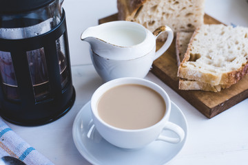 Coffee with milk and fresh pastries for breakfast