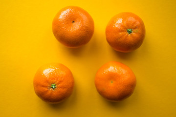 ripe mandarins on a orange bacground