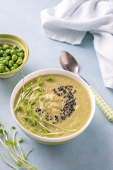 Green pea soup in bowl