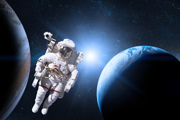 Obraz na płótnie Canvas Astronaut in outer space on background of the planet. Elements of this image furnished by NASA.