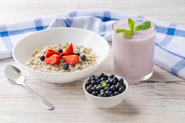 Healthy breakfast of muesli, berries with yogurt