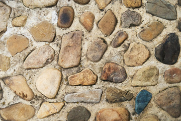 Stone path walkway made of pebbles and concrete. Natural texture for  background
