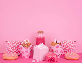 Muffins in colorful paper baking cup with red hearts.