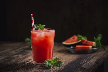 Fototapeten Refreshing summer watermelon juice in glasses with slices of watermelon © makistock