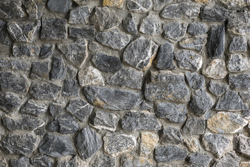 Rock wall texture background ,wall of natural decorative stone
