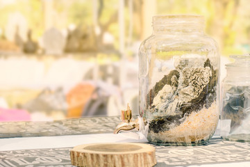 Faucet / View of brass faucet on bottle glass.