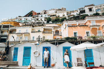 Fototapeta premium Spouses are resting on the sea in Italy, Positano. Honeymoon. Love story