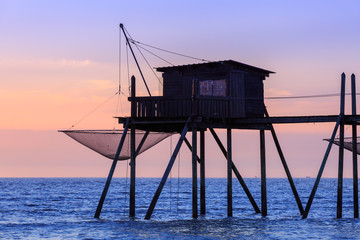 Fototapeta na wymiar Beautiful view of fishing huts at sunset over the Atlantic Ocean