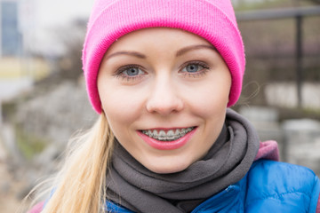 Smiling woman wearing pink beanie