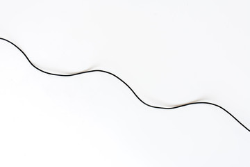 Black wires on white background..Black power cable line on white background.