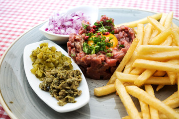 tasty Steak tartare (Raw beef) - classic steak tartare on white plate