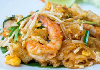 Pad thai with prawn serve in white plate with vegetable