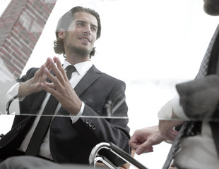 business partners sitting at a Desk