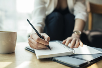 Woman Writing in Notebook