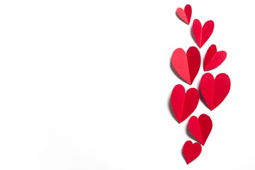 Red handmade paper hearts on a white background