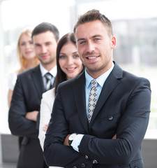 closeup. leader standing in front of the business team