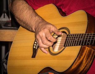 Fototapeta premium Man playing acoustic guitar
