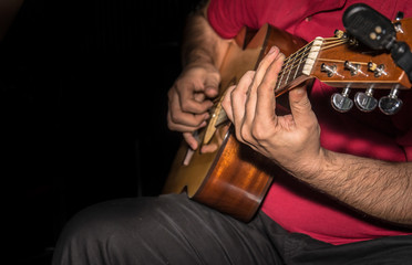 Fototapeta premium Man playing acoustic guitar