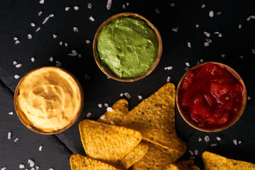 Triangular corn chips, mexican nachos with sauces