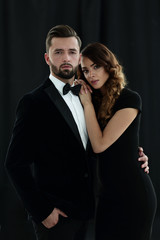 Elegant couple passing in classic clothes.