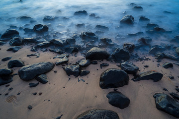 Stones on the sandy beach