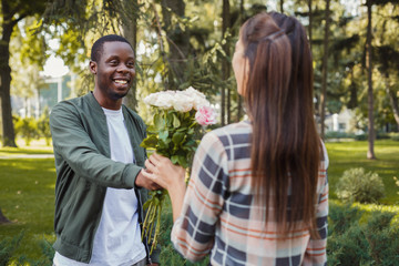 Man giving flowers for his beautiful girlfriend