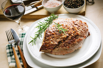 Grilled meat with rosemary, salt and pepper in grains