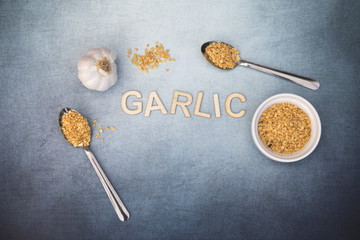 Garlic food background with garlic flakes and whole garlic, taken with copy space