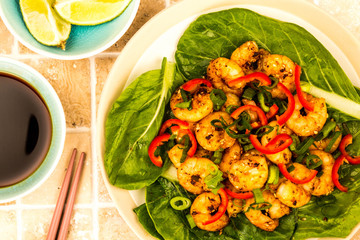 Fried Chinese Style Chilli Prawns On A Bed Of Steamed Pak Choi Greens