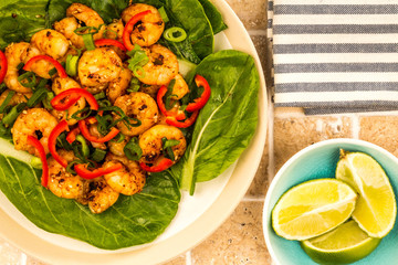 Fried Chinese Style Chilli Prawns On A Bed Of Steamed Pak Choi Greens